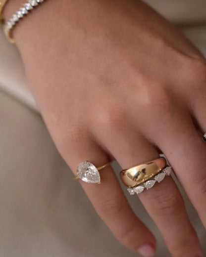 Pear east west eternity ring